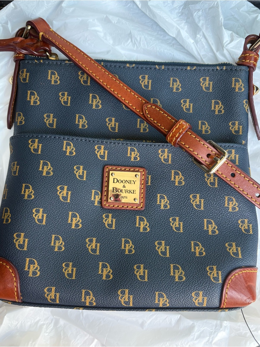 Dooney & Bourke navy with Brown Trim Monogram Crossbody